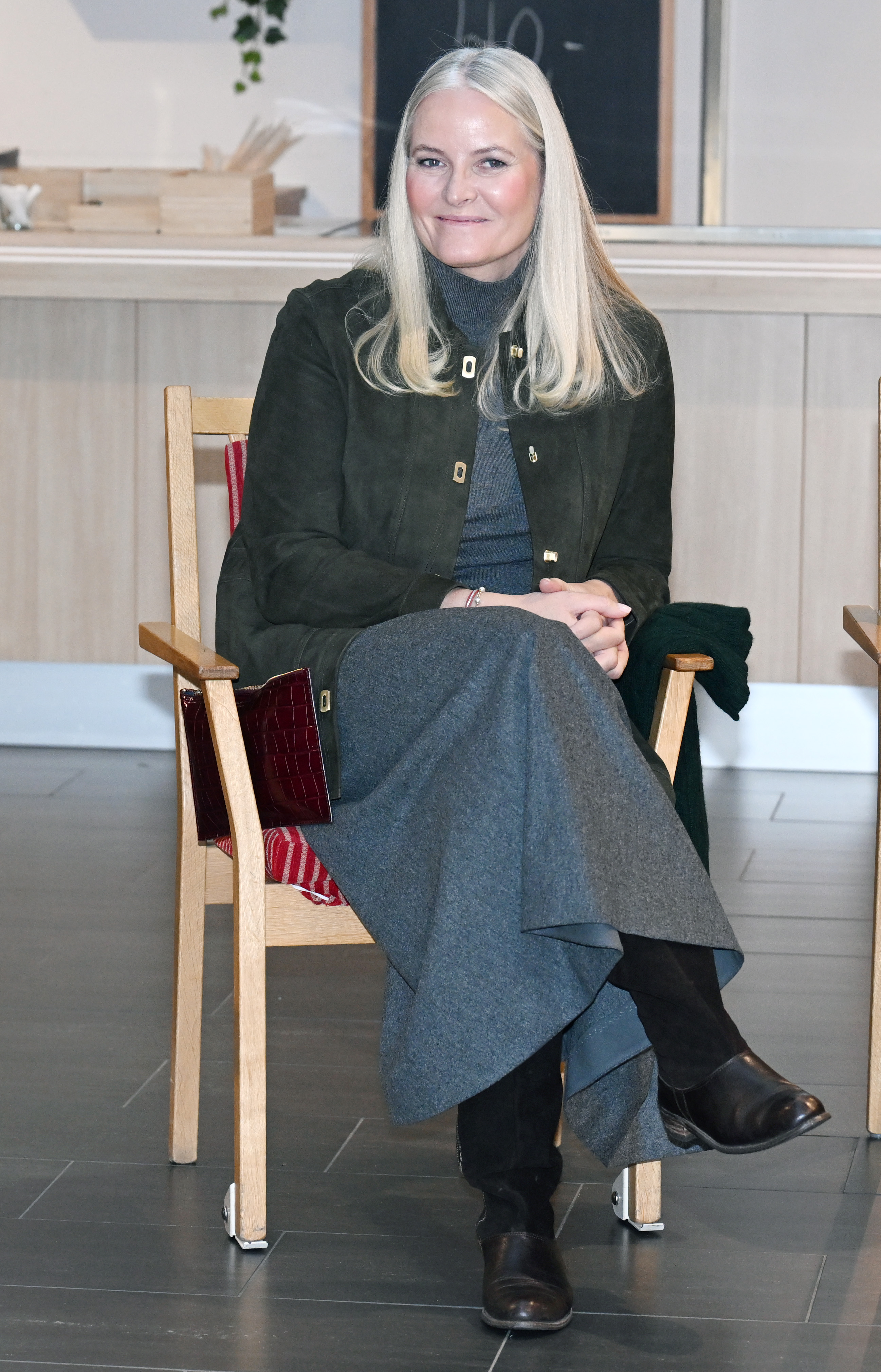 Crown Princess Mette-Marit sitting in a chair