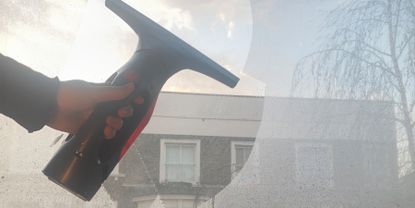 Image of Vileda window vacuum being used to take away condensation from windows 