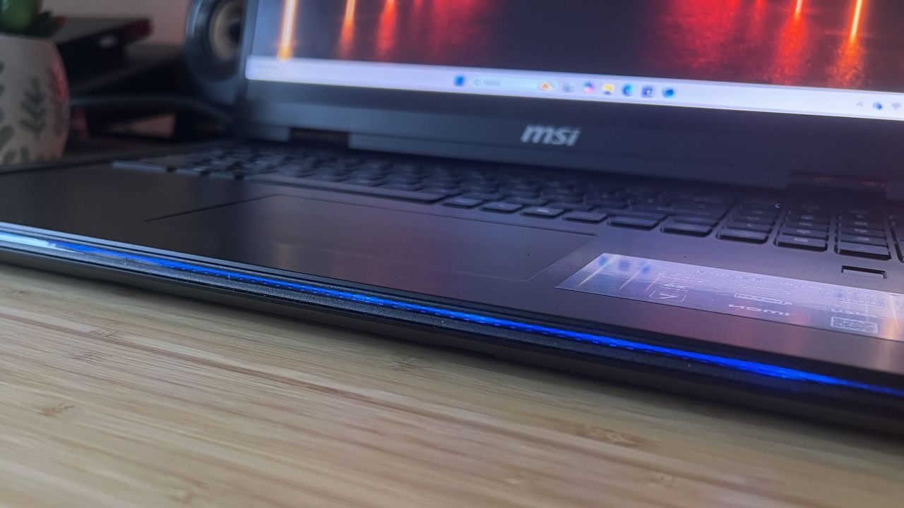 Front lip of MSI Raider A18 HX gaming laptop with slim line of RGB lighting enabled
