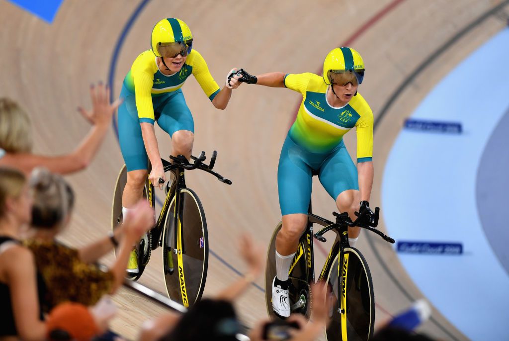 Amy Cure and Annette Edmondson of Australia celebrate winning gold against New Zealand in the Women's 4000m Team Pursuit Gold Fina