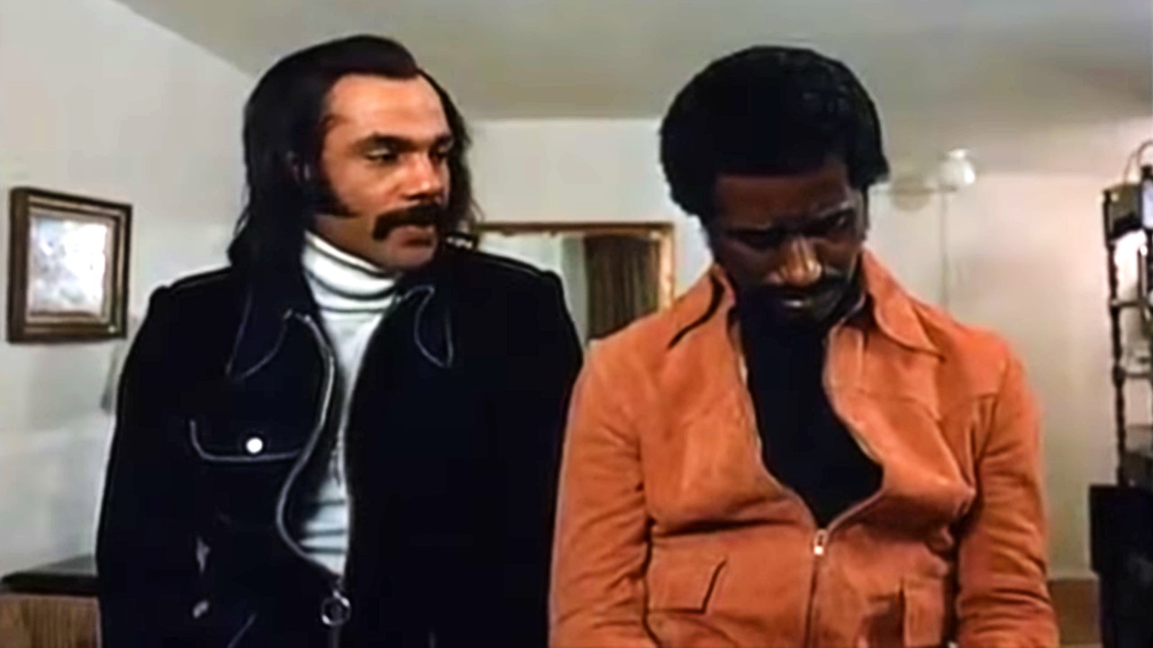 Youngblood Priest (Ron O'Neal) conversing in Superfly