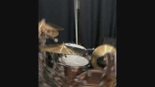 Blurred shot of DW drum kit with Paiste cymbals 