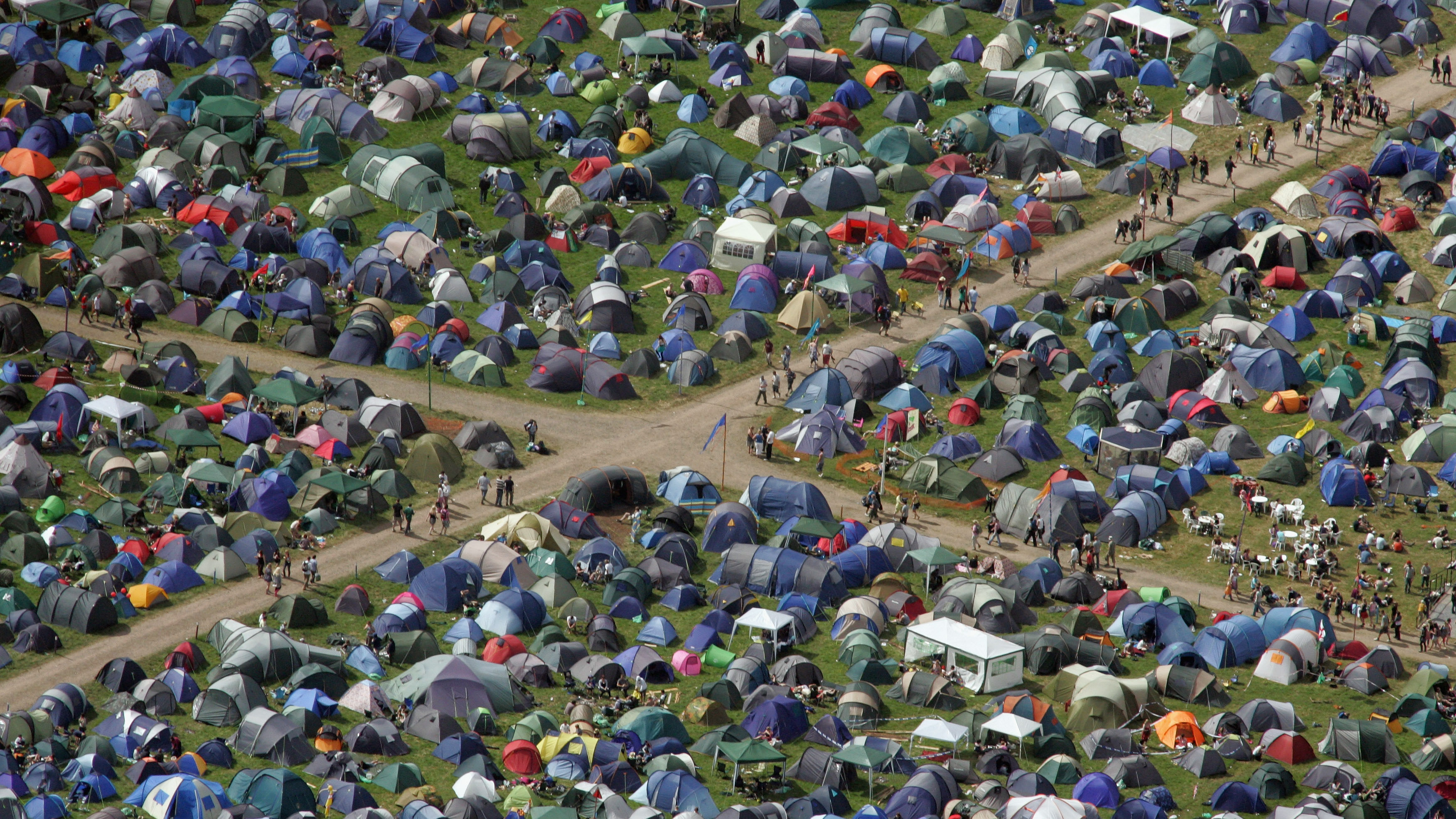 The trick to capturing people or big crowds is to shoot from above an free space sideways – not straight down – using a longer lens. A Mavic 2 Zoom might help for images like this of Glastonbury Festival