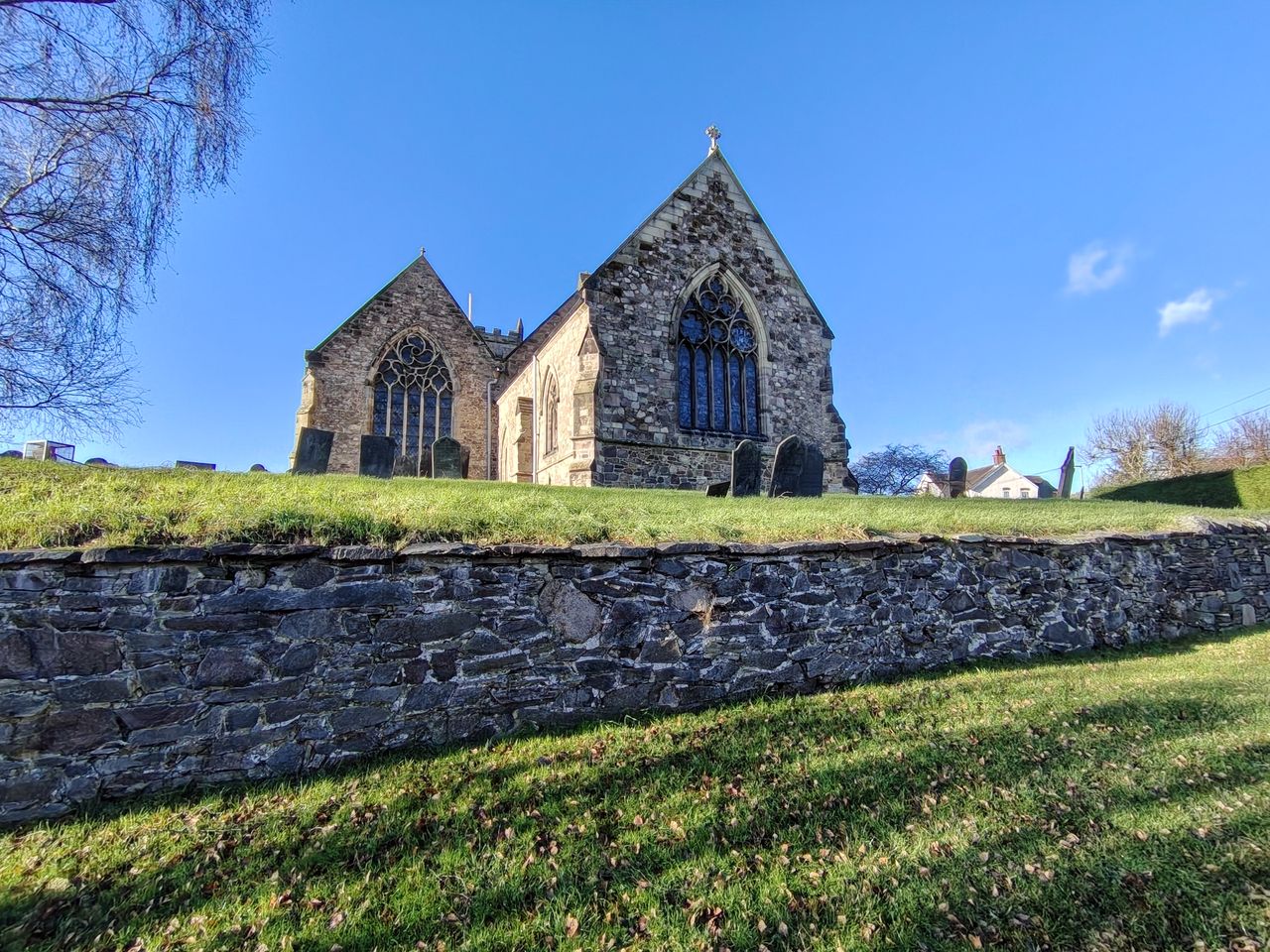 Large stone church on a green field