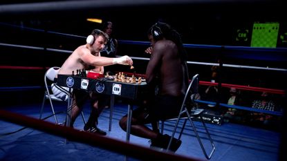 Players participate in a chessboxing match in Smallburgh, England, on July 6, 2024. 