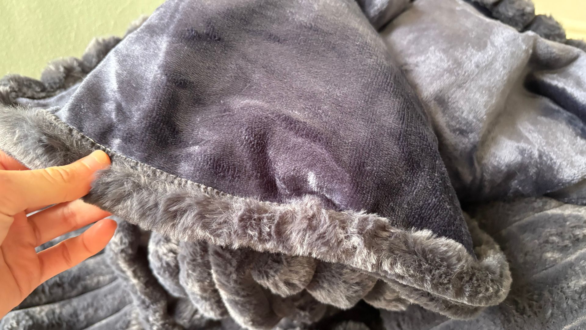 The Morphy Richards EverCosy Heated Throw on a chair, being tested for our review