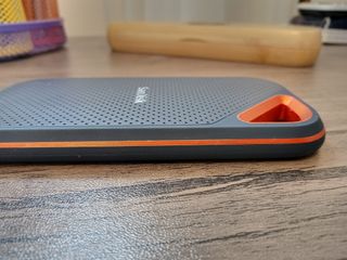 A black and orange SanDisk Extreme PRO Portable SSD