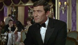On Her Majesty's Secret Service George Lazenby enjoying a conversation seated in a restaurant