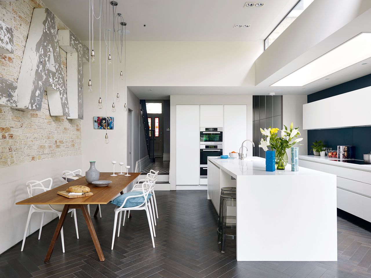 bright white open plan kitchen diner