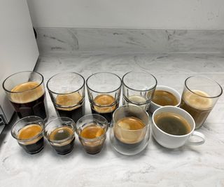 Jura Z10 next to 11 cups of coffee