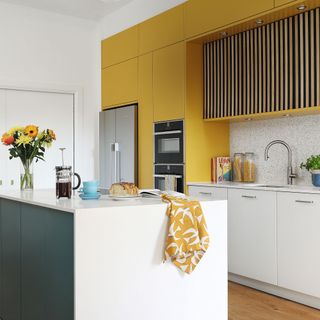yellow kitchen wall with island unit