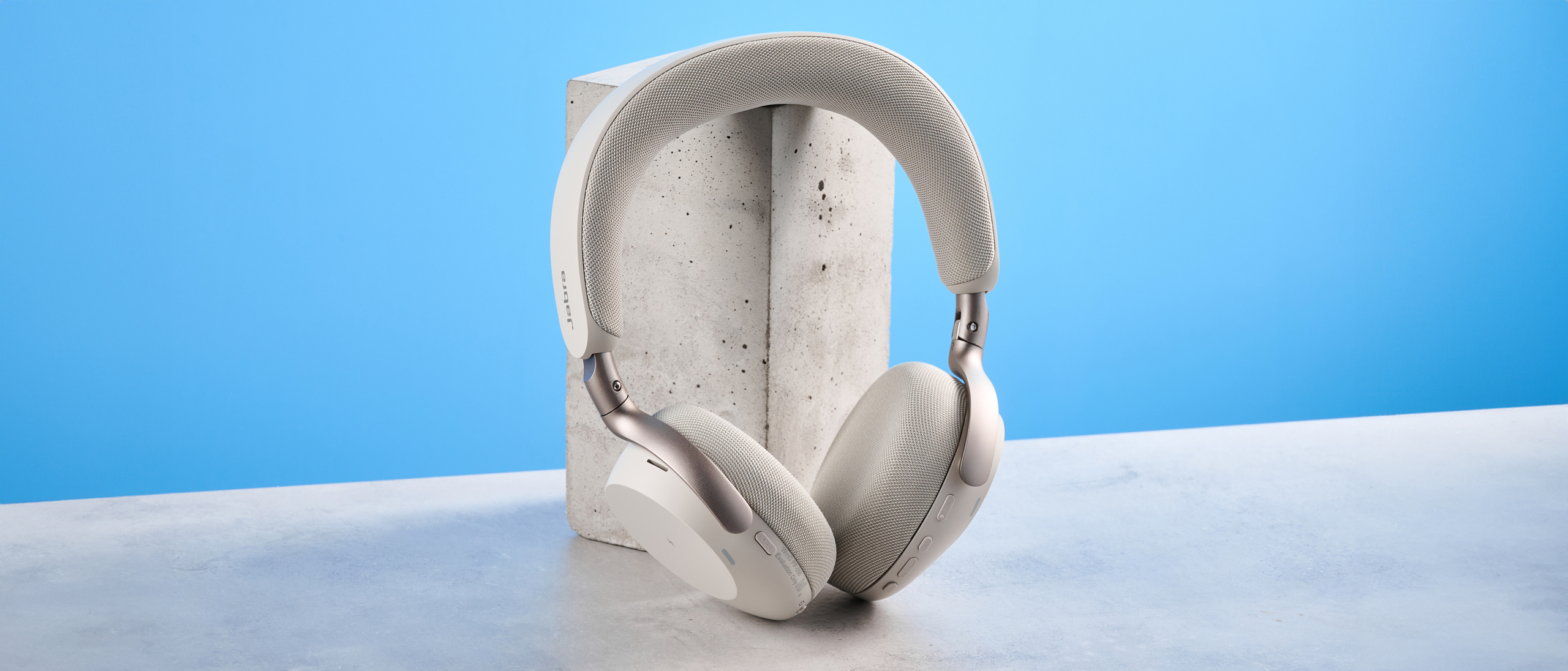 Jabras Evolve3 75 conferencing headset on a stone surface with a blue background