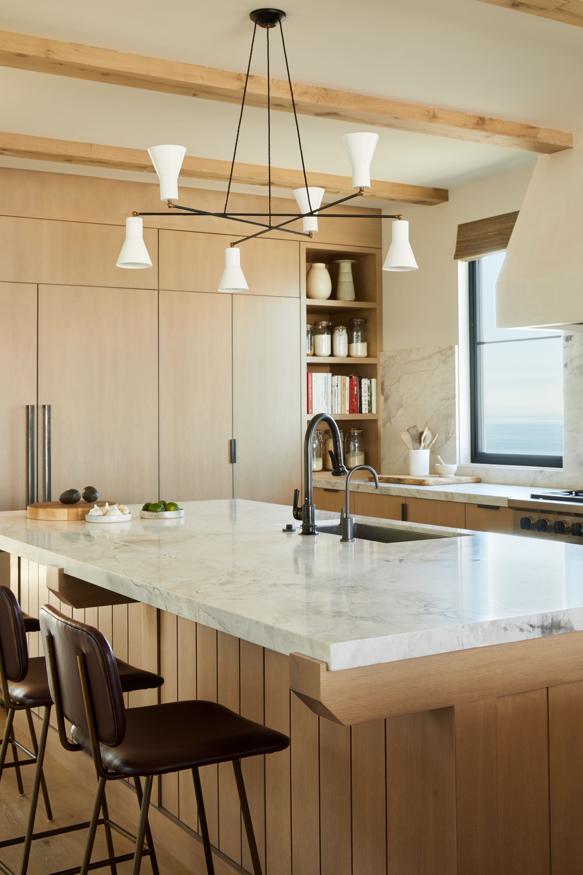 kitchen with marble countertop and slatted wood island