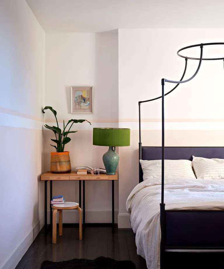 A bedroom painted in white and Tailor Tack No.302
