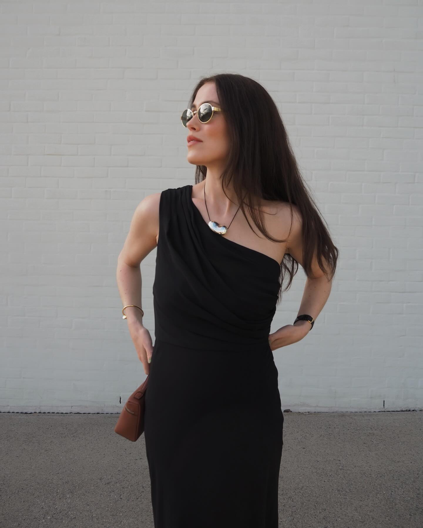 Woman wearing a black dress outfit.