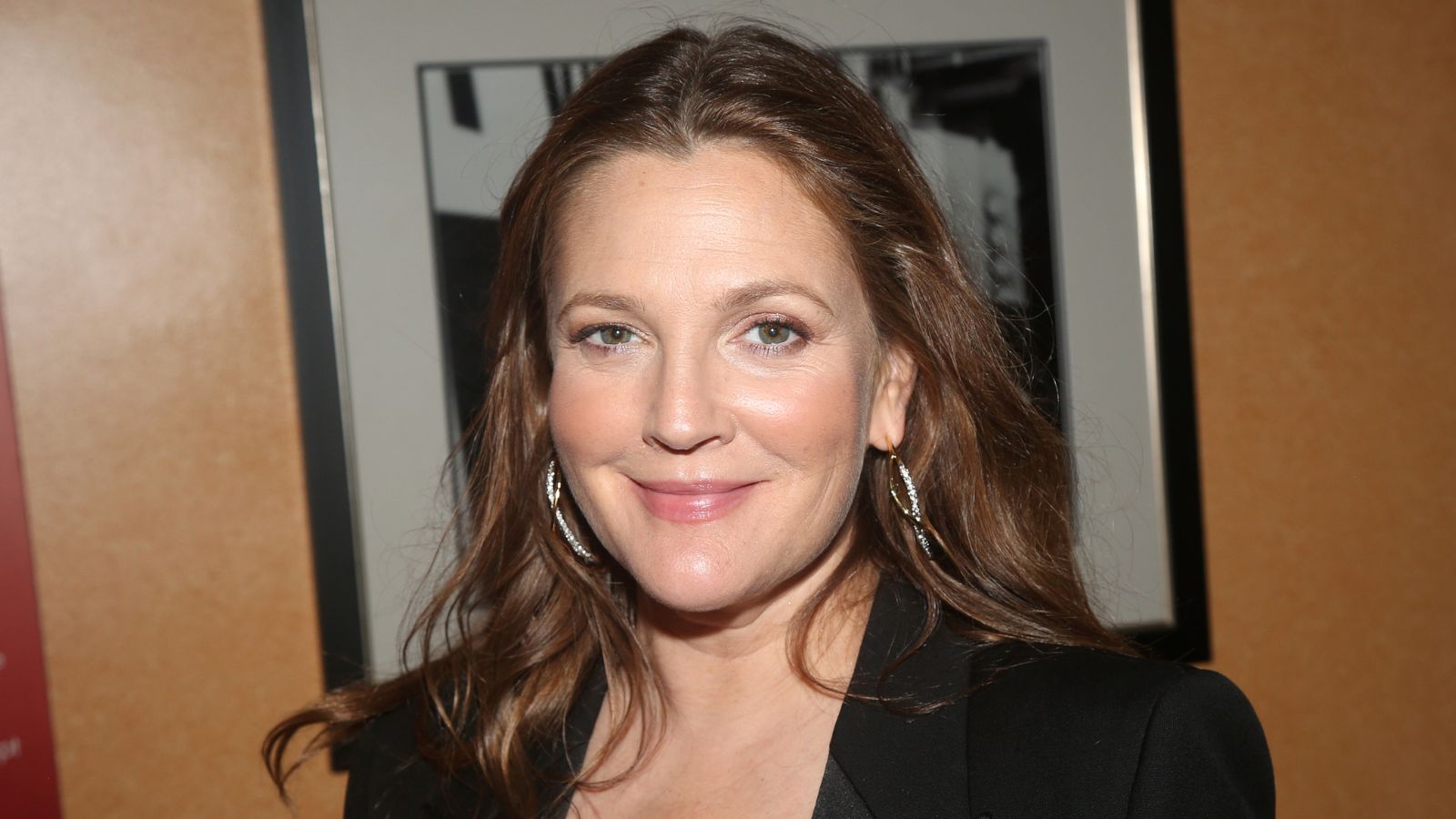 drew barrymore in front of a picture frame