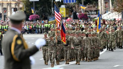 US soldiers march during a military parade in Kiev