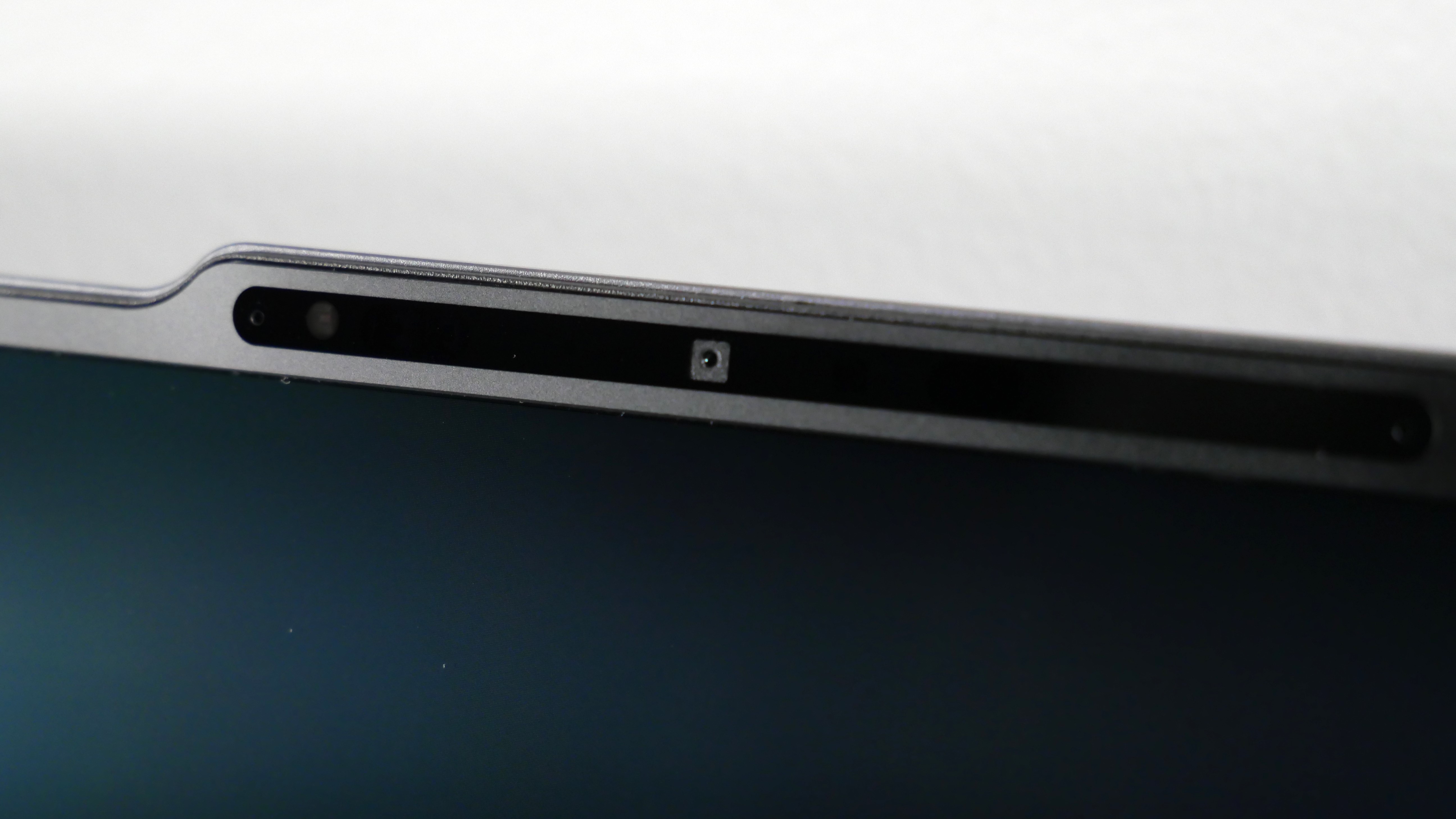 Lenovo ThinkPad X9-15 Gen 1 Aura Edition open against a white wall, highlighting the webcam.