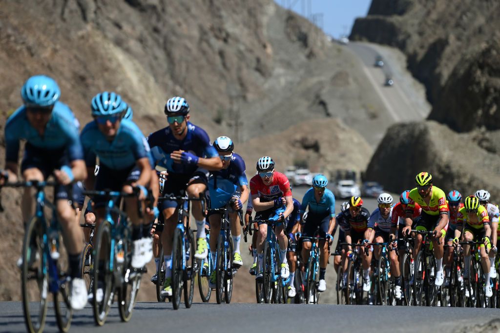 JABAL AL AKHDHAR OMAN FEBRUARY 15 EDITORS NOTE Alternate crop Matteo Jorgenson of The United States and Movistar Team Red Leader Jersey C and teammates pick food bags at the feed zone during the 12th Tour of Oman 2023 Stage 5 a 1522km from Samail to Jabal Al Akhdhar 1214m TourofOman on February 15 2023 in Jabal Al Akhdhar Oman Photo by Alex BroadwayGetty Images