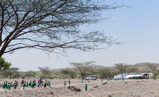 People walking towards vaccination centre in Kenya