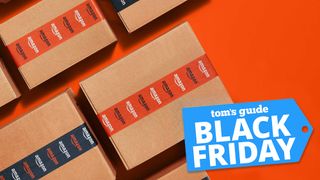 Promotional image showing multiple boxes with Amazon-branded tape against an orange background with Tom's Guide Black Friday badge overlaid