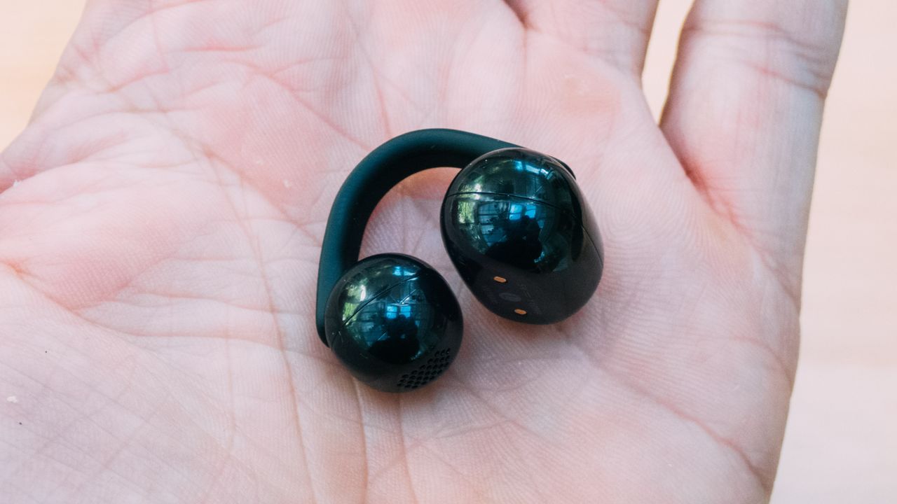 A Sony Linkbuds Clip earbud in the palm of a hand