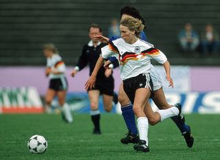 Heidi Mohr of Germany battle for the ball during the women's European Championship semi-final match between Italy and Germany at the Leimbach Stadium on June 28, 1989 in Siegen, Germany. (Photo by Bongarts/Getty Images)