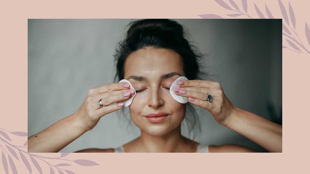 woman removing mascara with two cotton pads after learning how to remove mascara properly