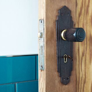 Wooden door with metal hardware and knob