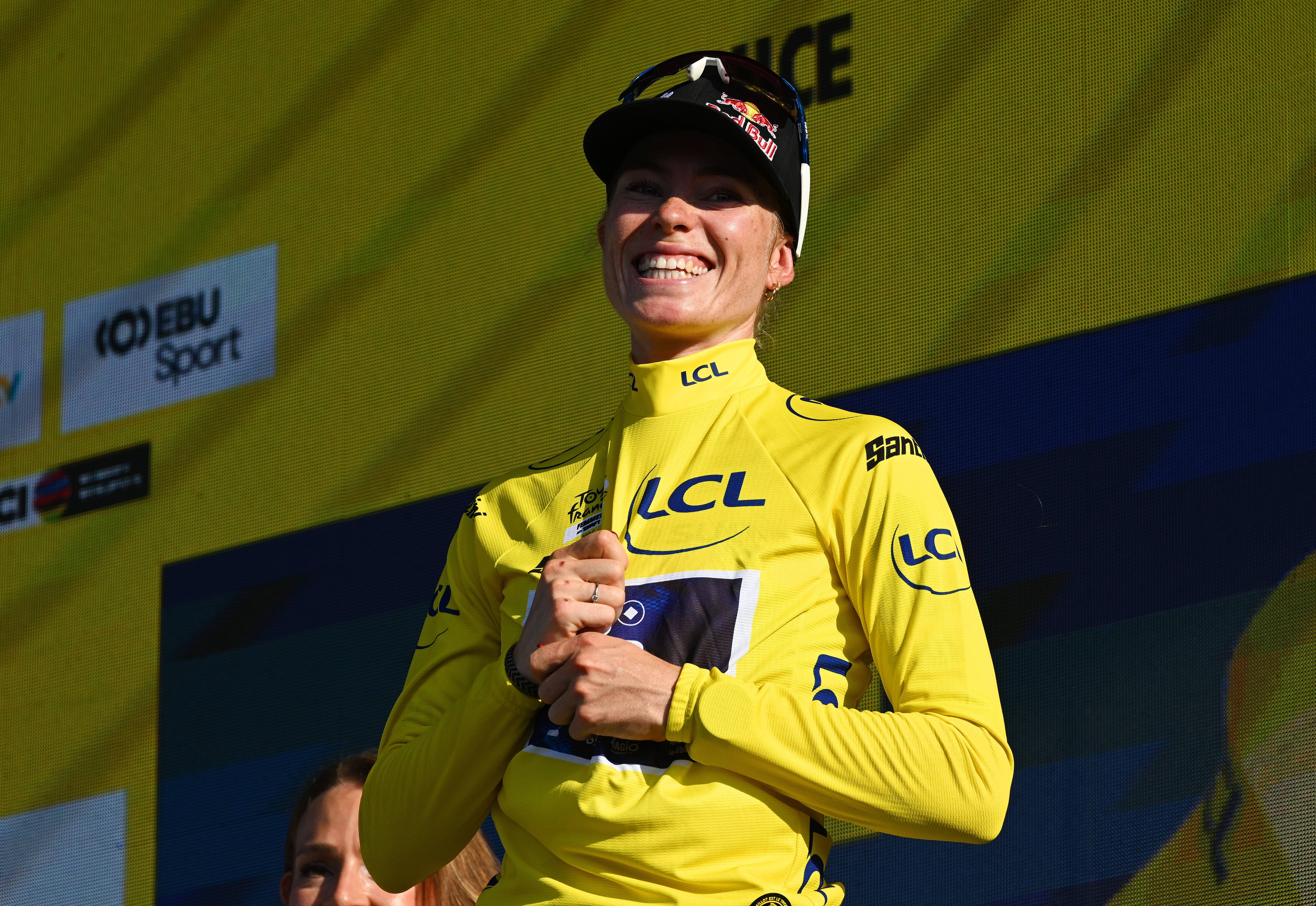 Vollering on the podium in the yellow jersey
