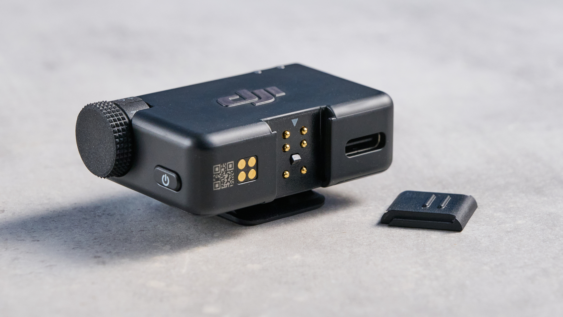 the dji mic mini 2 for camera and smartphone conent creators photographed against the blue tom's guide background