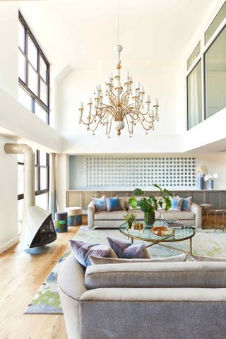 Large living room with high ceilings and chandelier