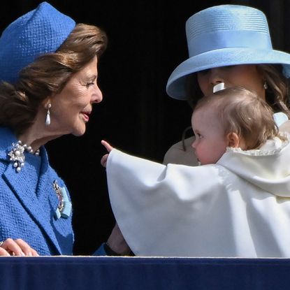 Queen Silvia looking at Princess Ines