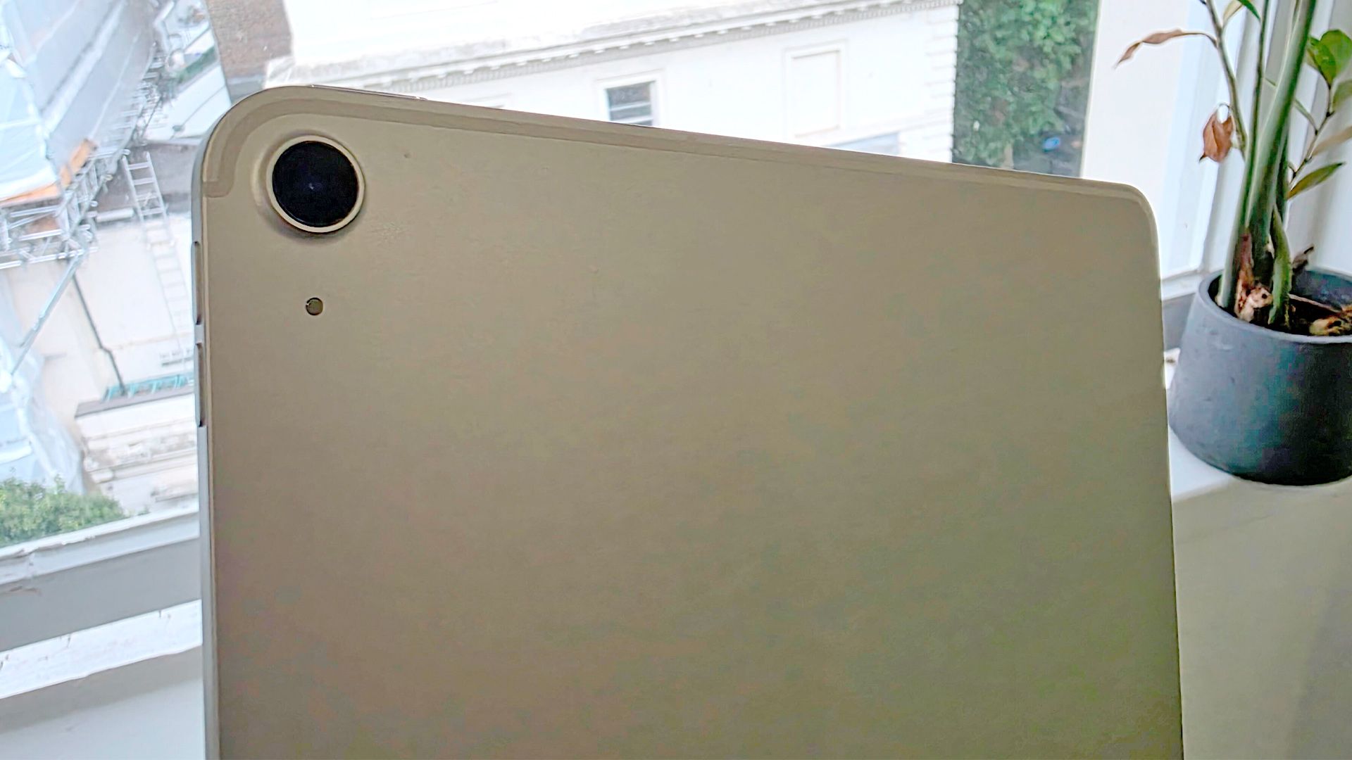 Apple iPad Air 13-inch (2025) tablet in front of window showing rear camera