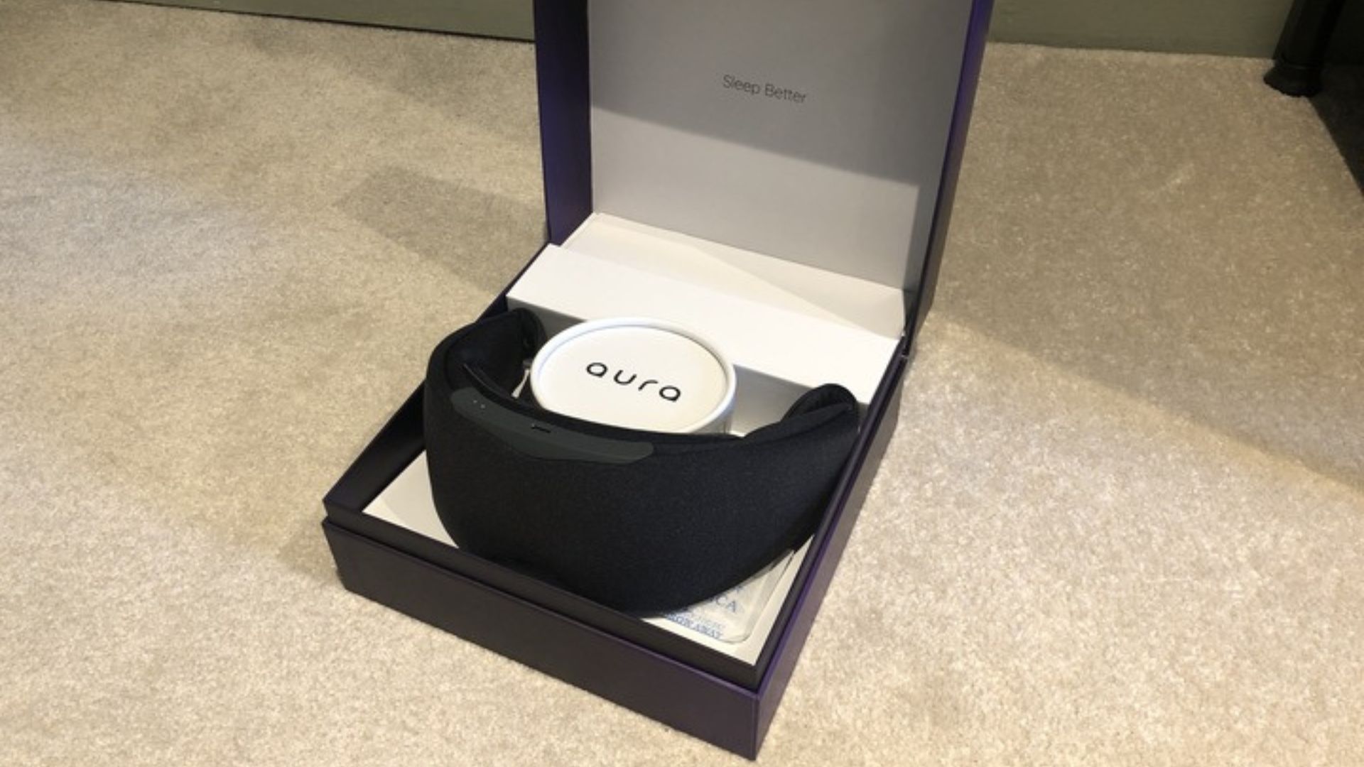 The Aura Smart Sleep Mask in its box