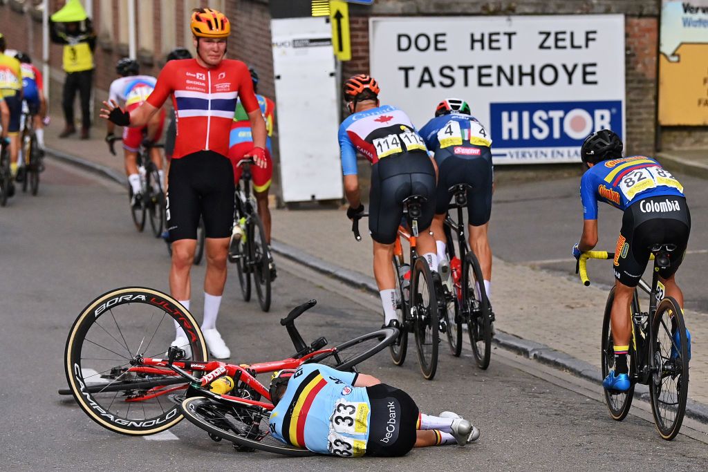 LEUVEN BELGIUM SEPTEMBER 24 Soeren Waerenskjold of Norway and Lennert Van Eetvelt of Belgium injured after being involved in a crash during the 94th UCI Road World Championships 2021 Men U23 Road Race a 1609km race from Antwerp to Leuven flanders2021 on September 24 2021 in Leuven Belgium Photo by Dirk Waem PoolGetty Images