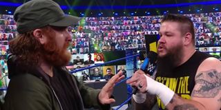 Sami Zayn being threatened by Kevin Owens