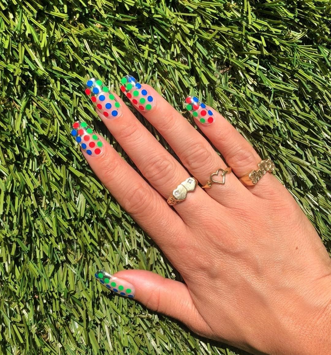 Colorful bold polka dot nails.
