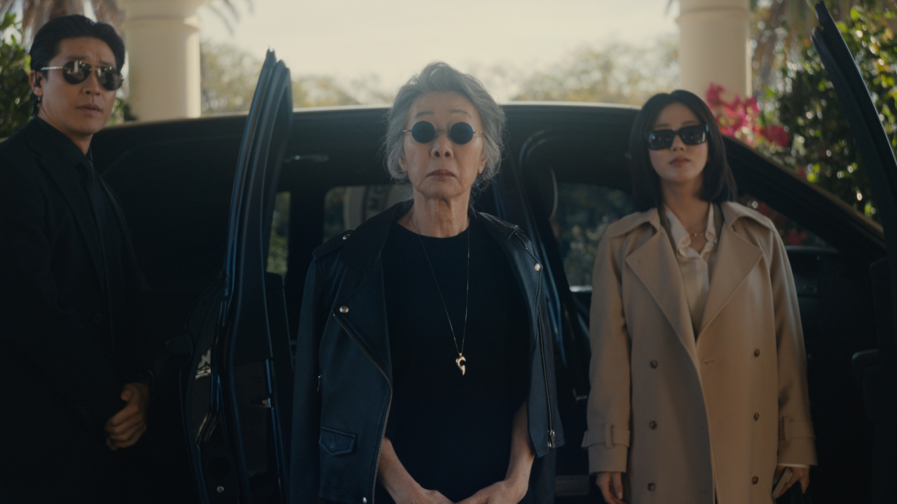 JB (Jason Jin), Chairwoman Park (Youn Yuh-jung) and Eunice (Seoyeon Jang) arrive at the country club on Beef.