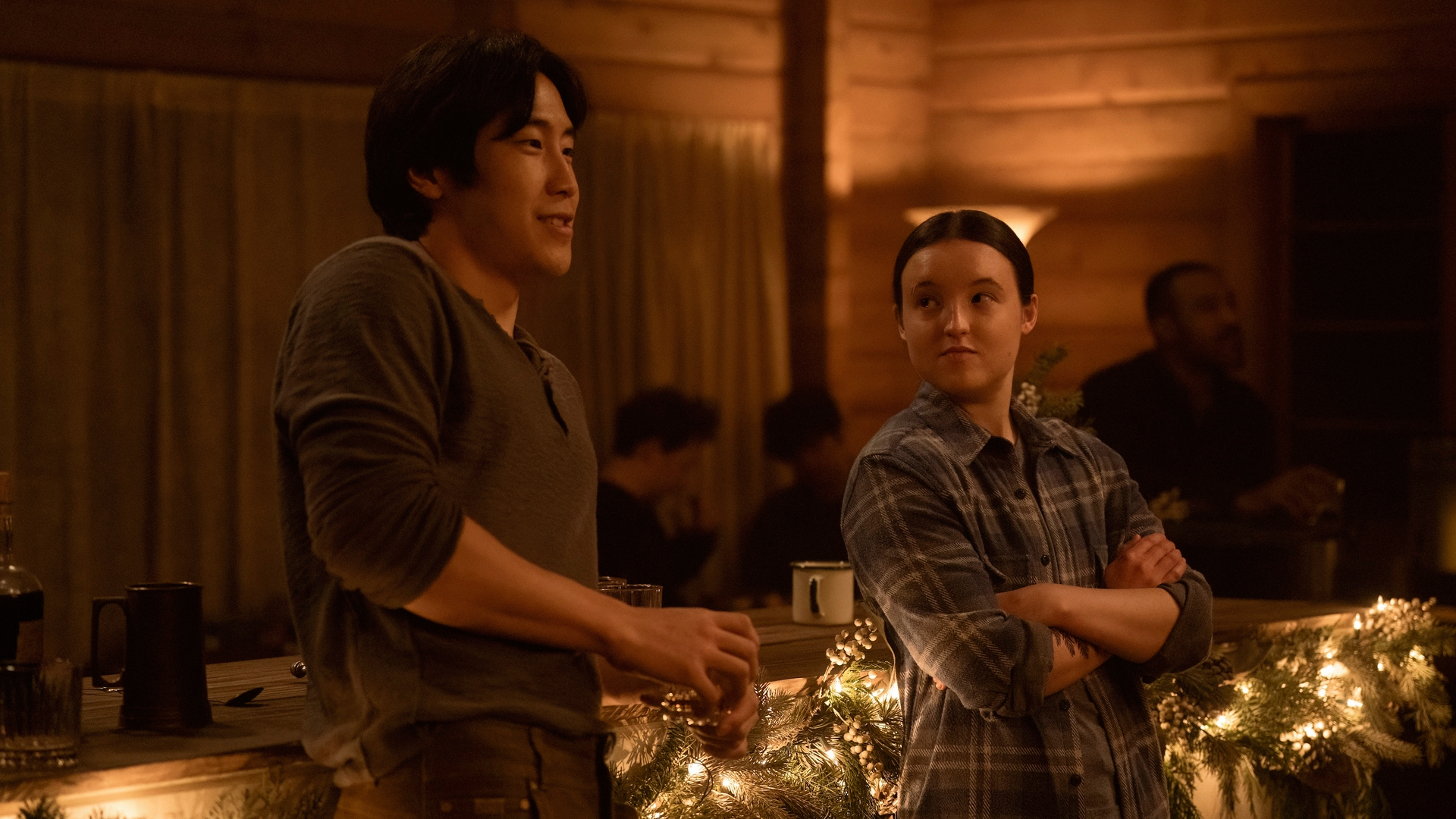 Jesse (Young Mazino) and Ellie (Bella Ramsey) chat inside the barn during a party in "The Last Of Us" season 2