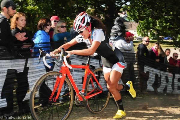 Linda Sone (Crossniaks p/b Wesley) running with her orange bike
