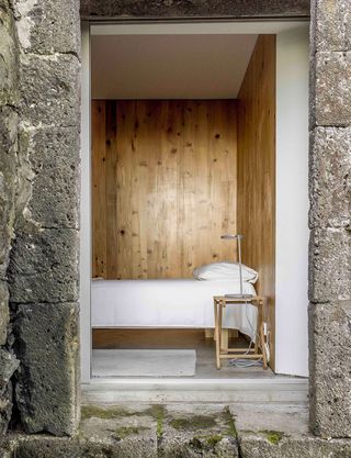 Interiors are enveloped in wood and concrete