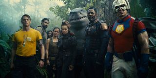 A handful of The Suicide Squad members lined up in the jungle.