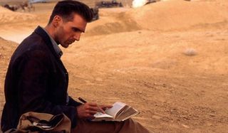 The English Patient Ralph Fiennes writing in his journal in the desert