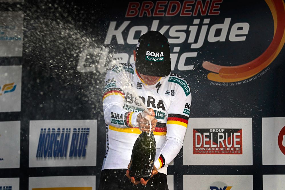 redene-Koksijde winner Pascal Ackermann celebrates on the podium