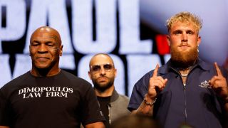 (L-R) Mike Tyson and Jake Paul speak onstage at the press conference in promotion for the upcoming Jake Paul vs. Mike Tyson boxing match at The Apollo Theater on May 13, 2024 in New York City.