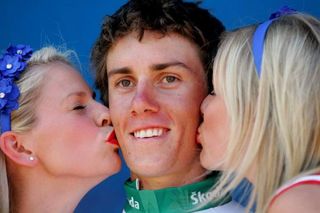 Tim Roe (Uni-SA) in the mountains jersey with the spoils of leading.