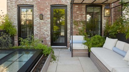 a backyard patio with outdoor seating