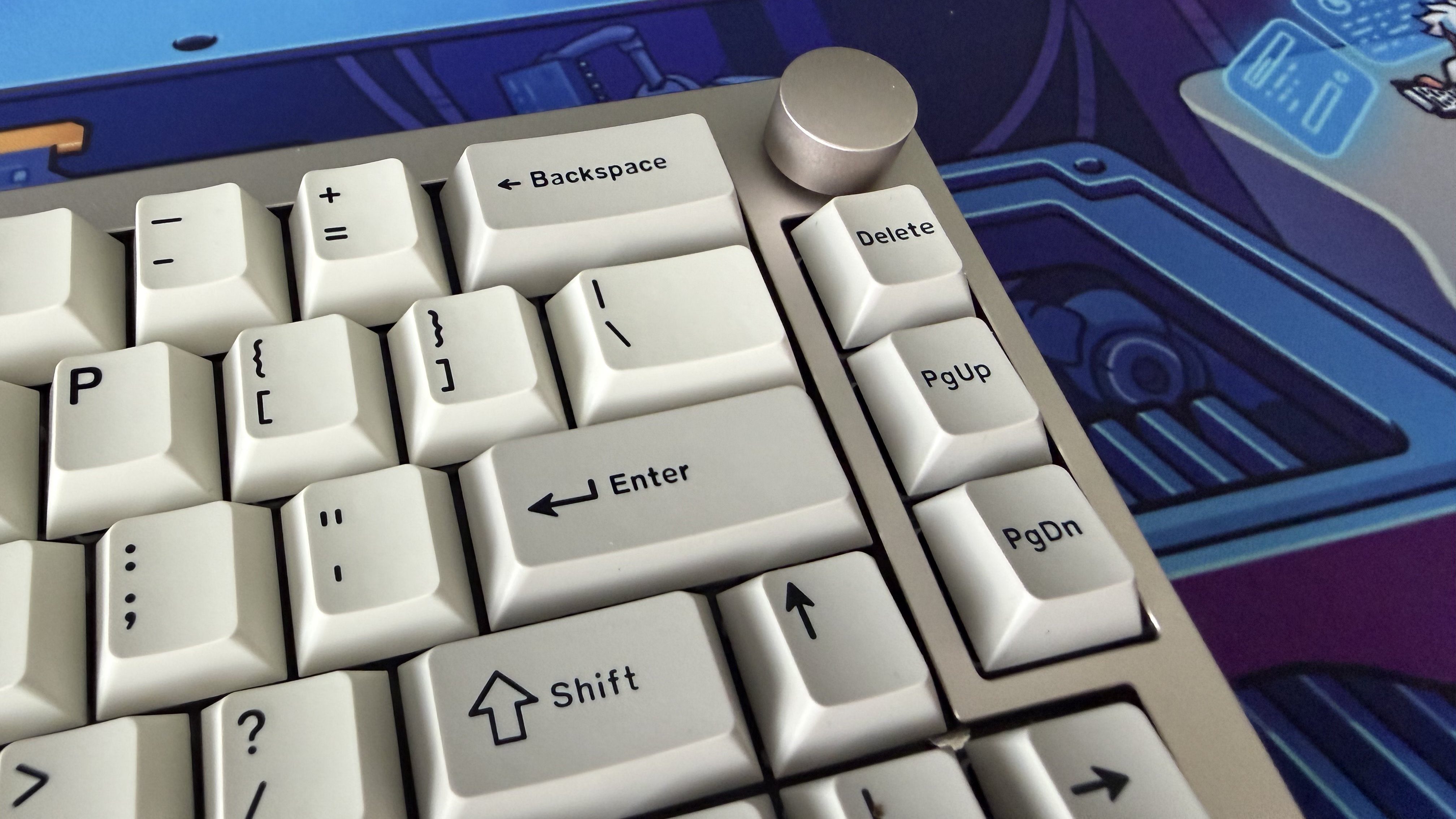A closeup of the Epomaker 65, with a particular focus on the Enter, Backspace, Shift, Arrow, Delete and Page Up and Down keys.