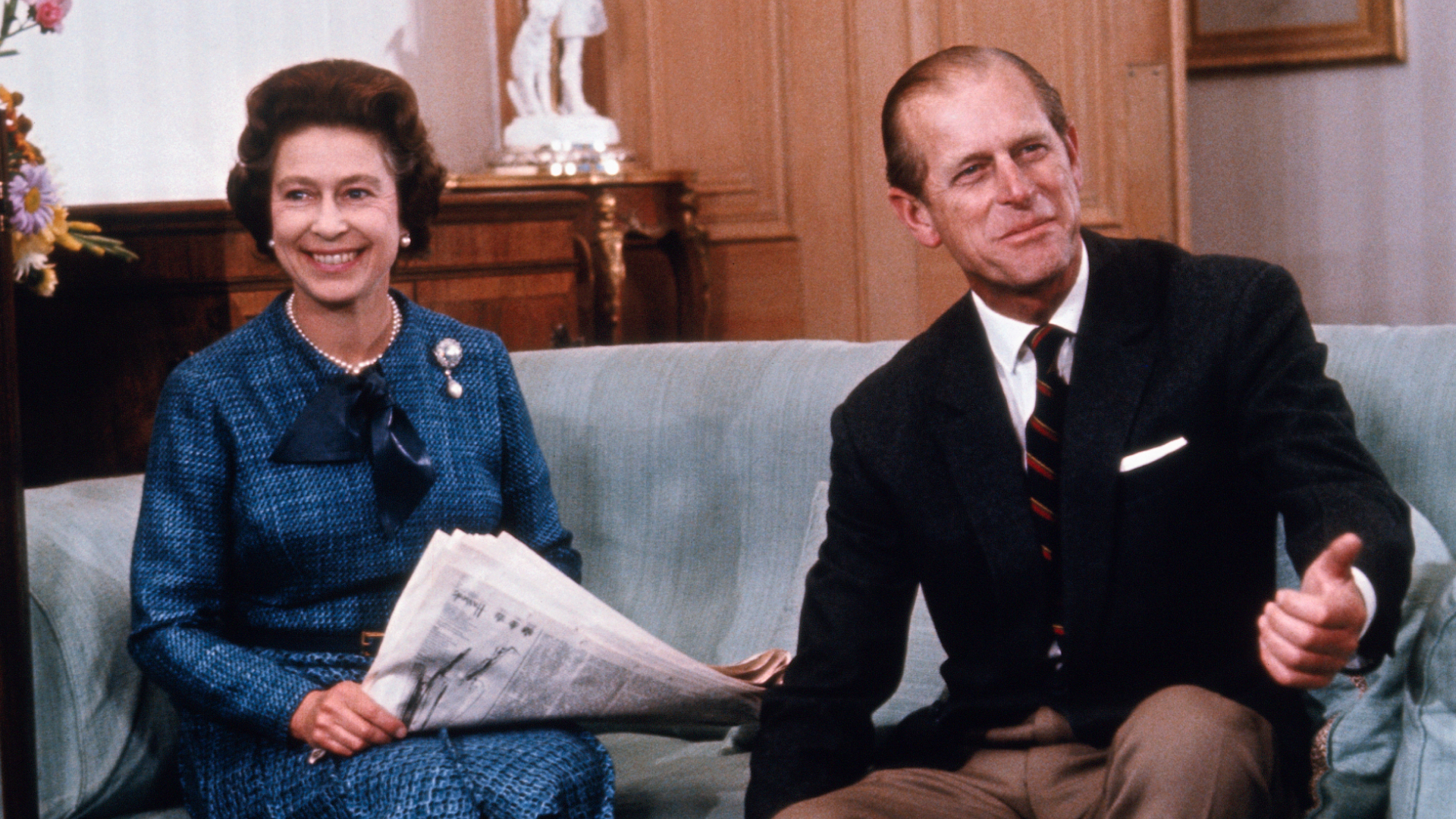 Queen Elizabeth II and Prince Philip relax at Balmoral castle in this 9/76 photo, released when she formally opened Parliament, last month. the year 1977 marks the 25th year of her reign